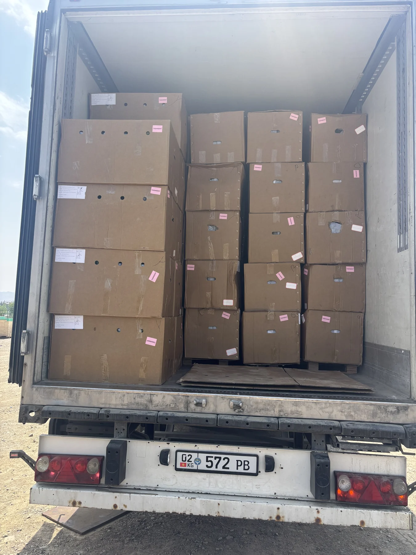 Boxed stock arranged inside a transport vehicle.